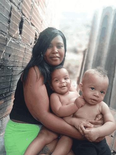 Priscila de Sousa, 37, and her children